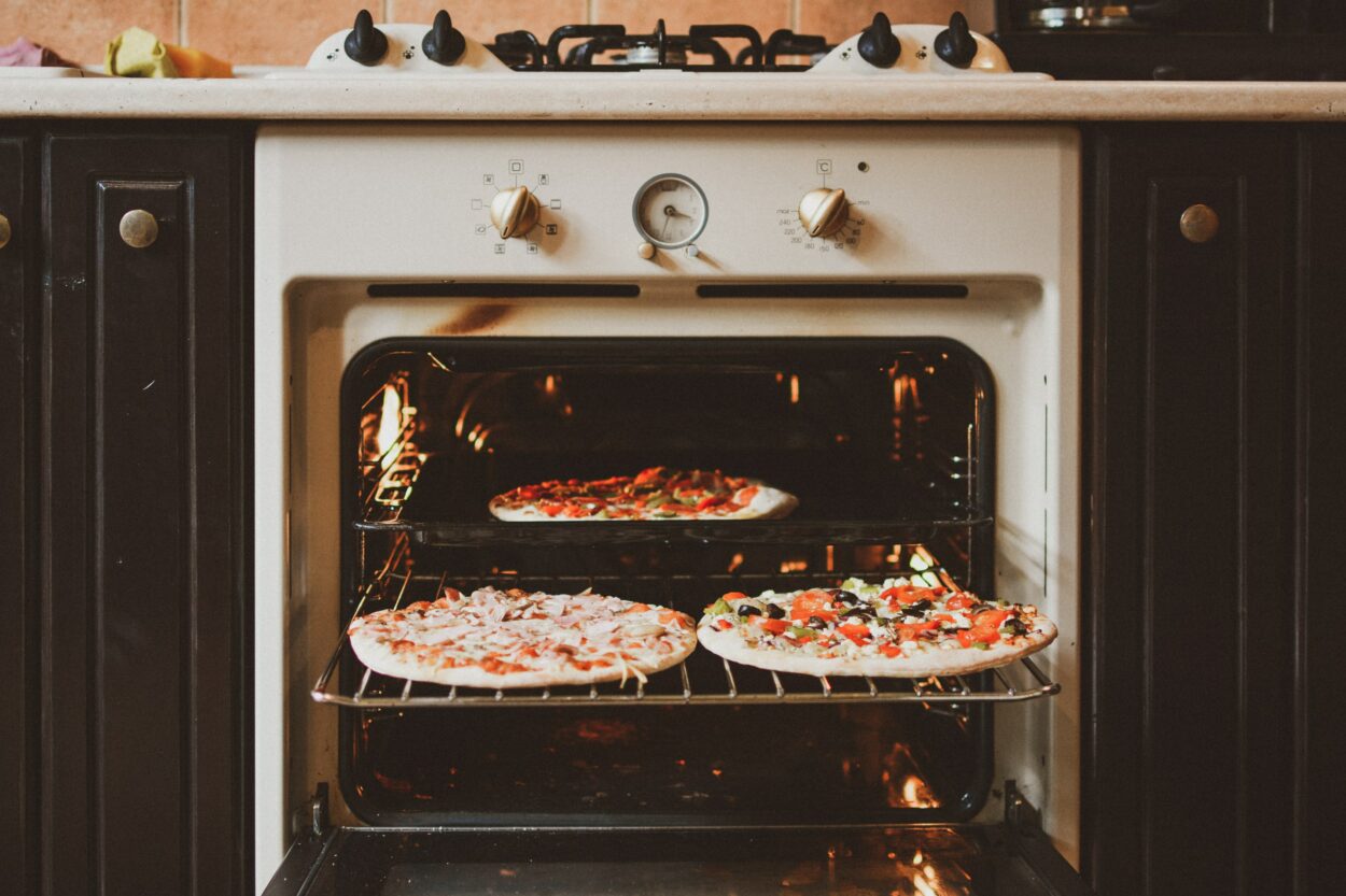 Thin crust pizzas baked in a grilled oven