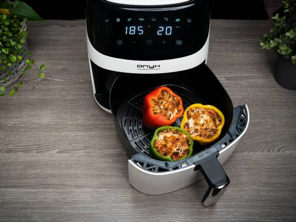 Filled capsicum being cooked in an air fryer