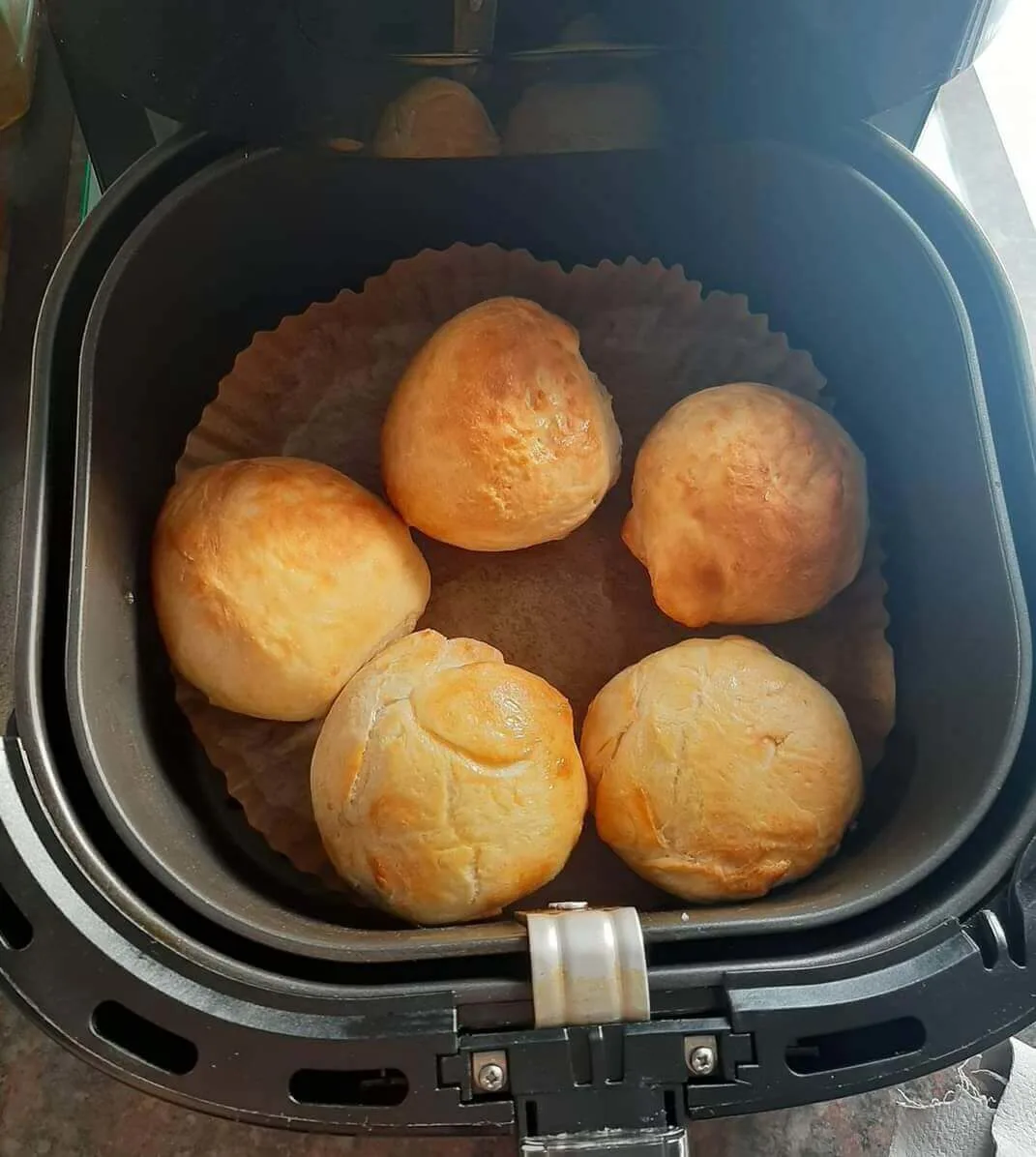 An image of air fried food in an air fryer.