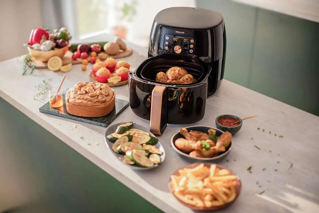 Dishes are placed beside an air fryer