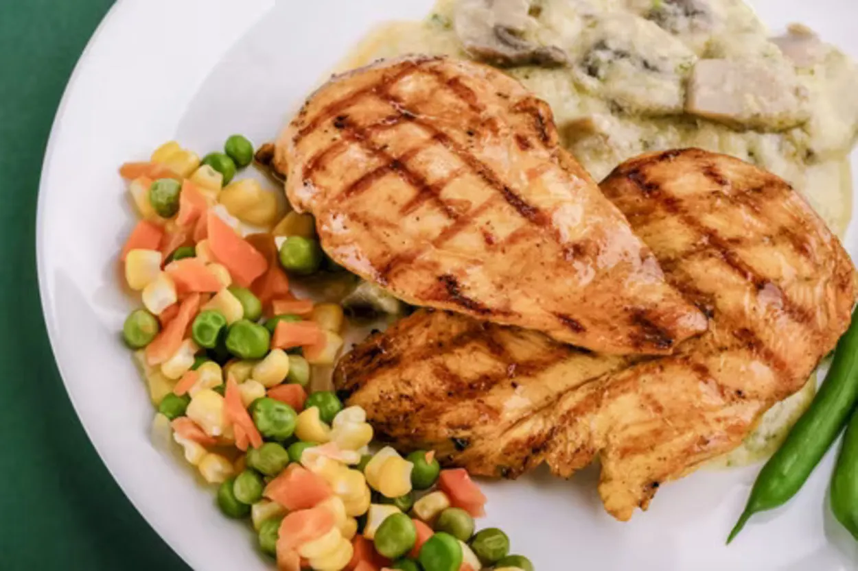 Air-fired chicken breast served with roasted veggies.