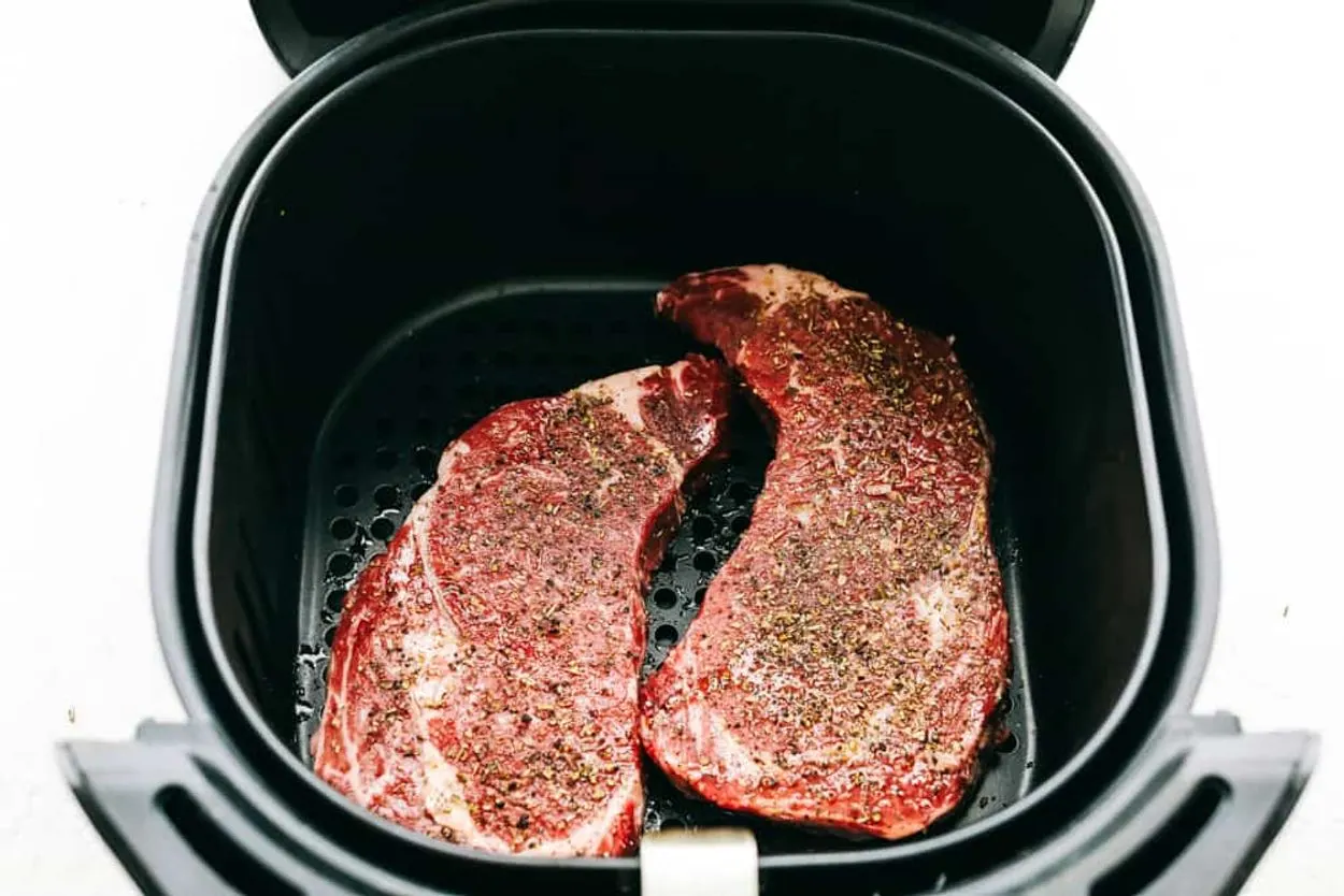 An image showing uncooked meat loaf placed in an air fryer
