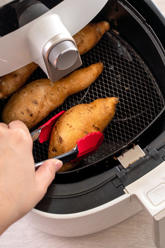 Healthy eating concept with roasted yams in an air fryer