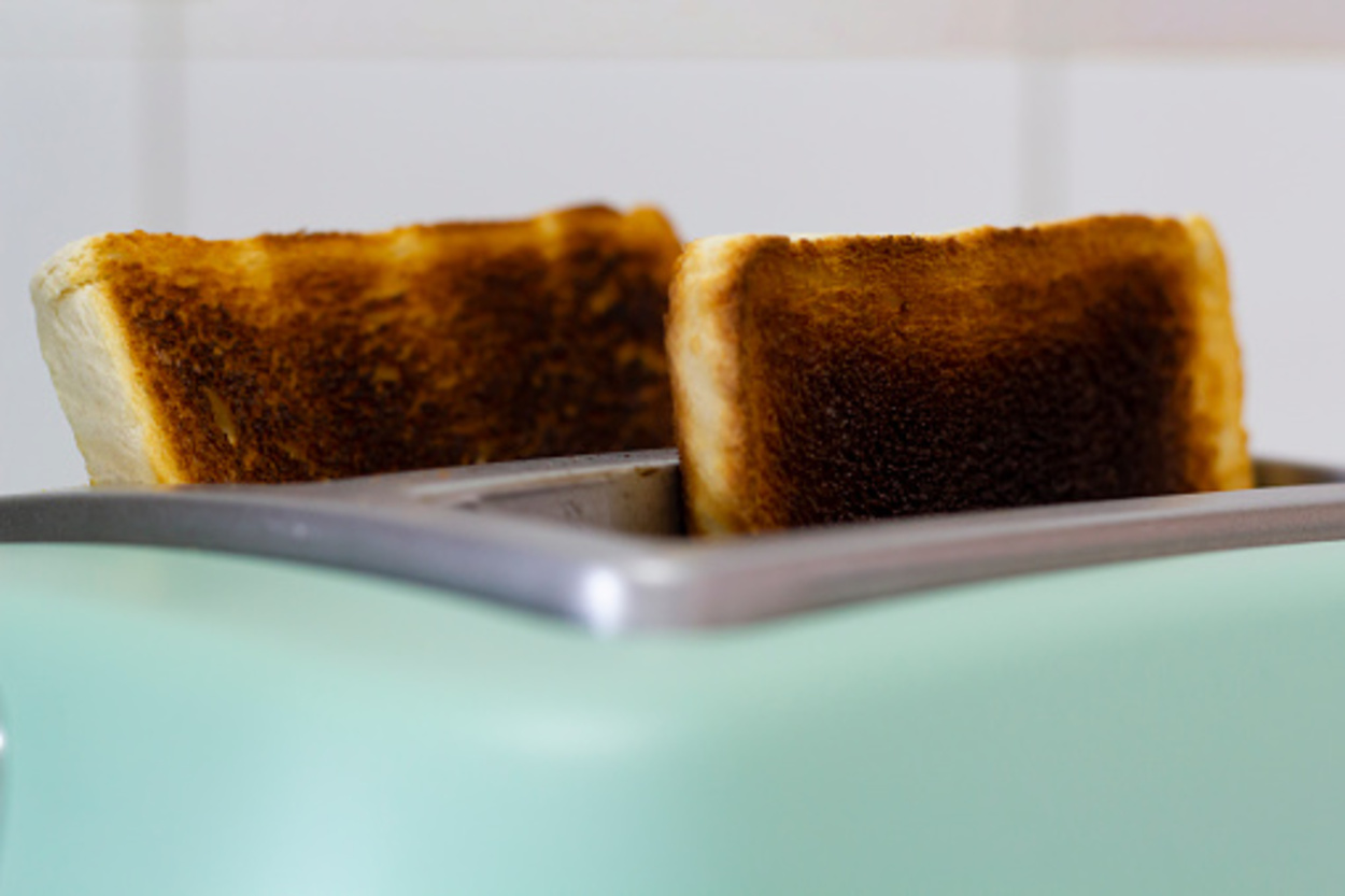 Burnt toast jumping out of the toaster