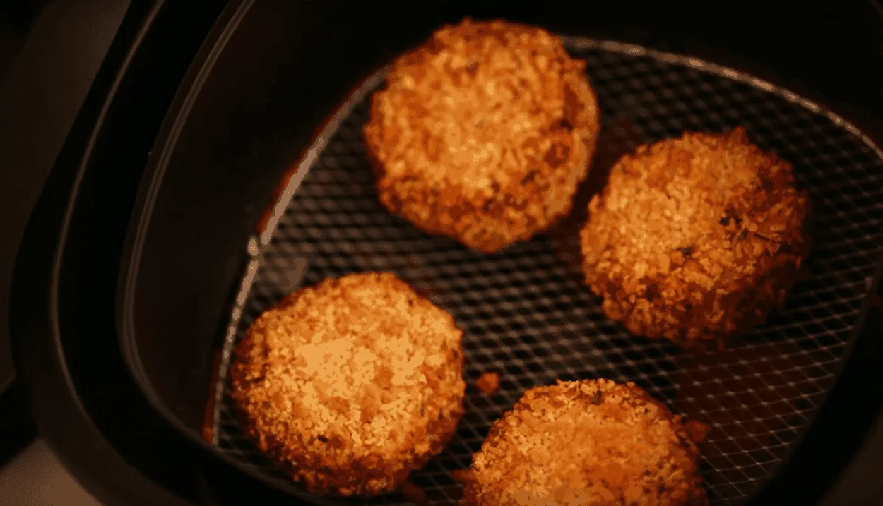 Crab cakes in an air fryer basket