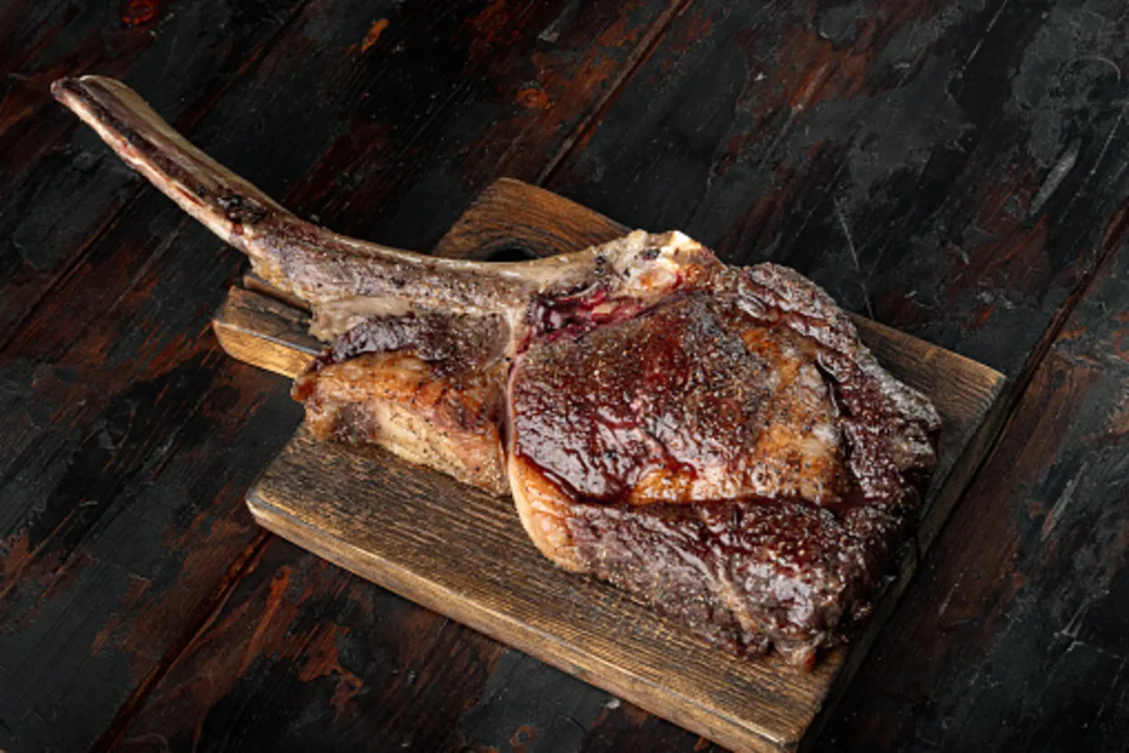 rib eye steak on wooden board