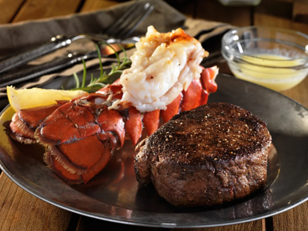 lobster tail alongside steak