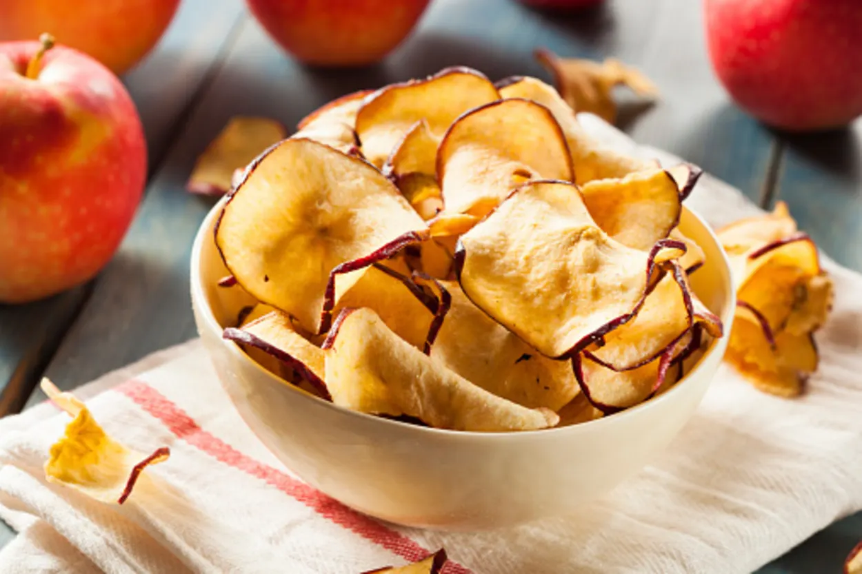 Crispy apple chips in a bowl