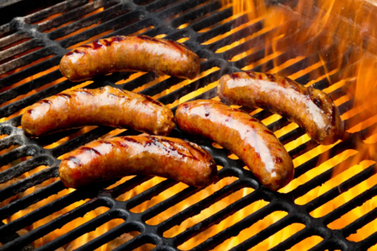 sausages on a charcoal grill
