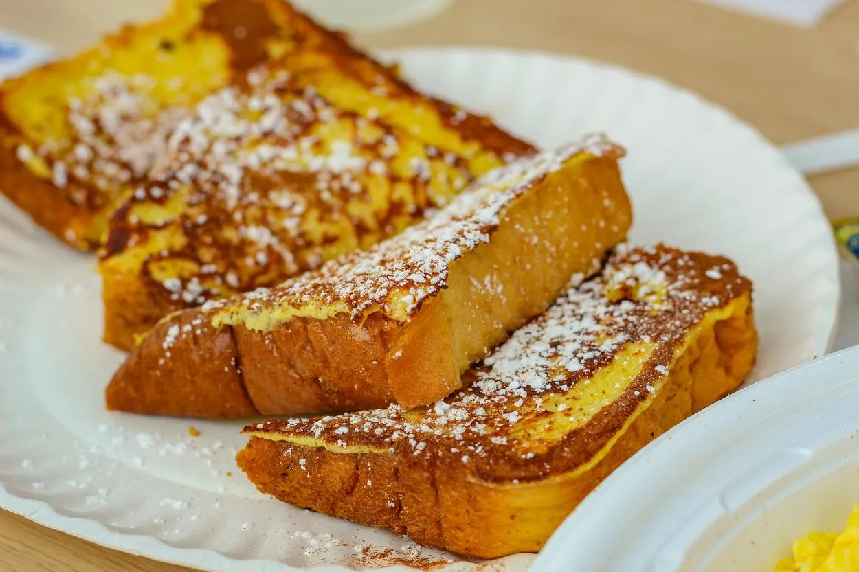 French toast with icing sugar on top. 