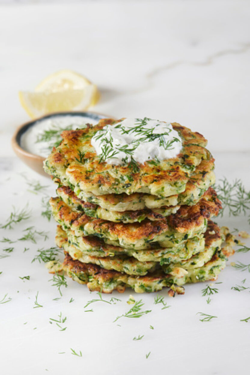 zucchini fritters with cream on top