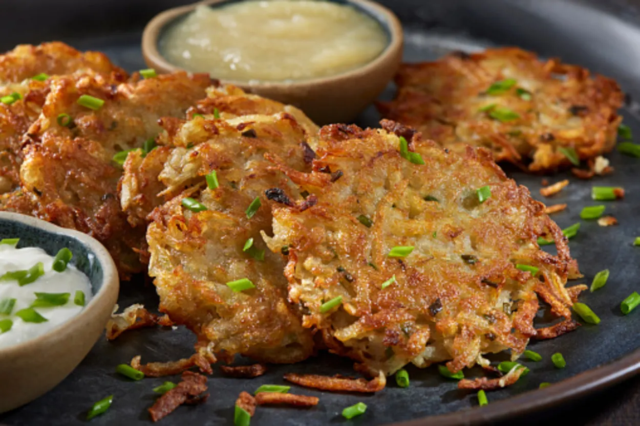 latkes with a dip in a plate