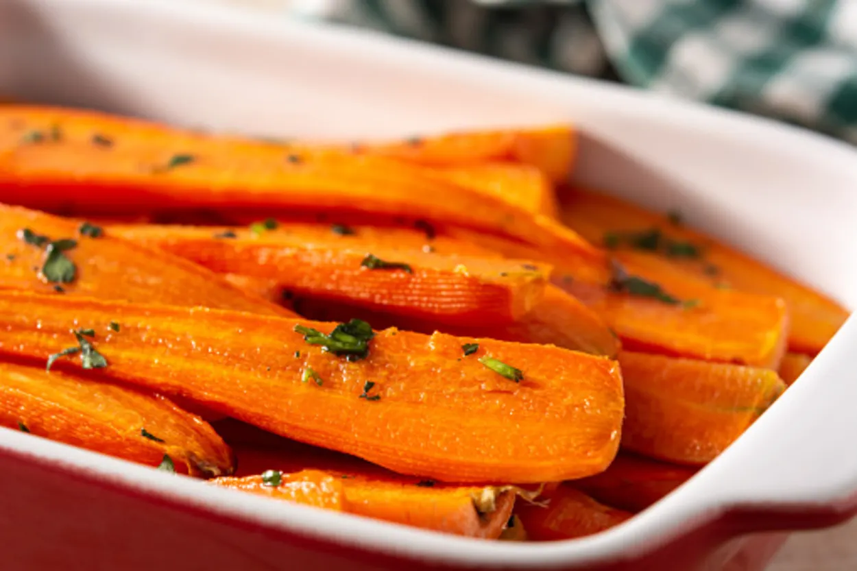 Carrots served with honey and parsley topping. 