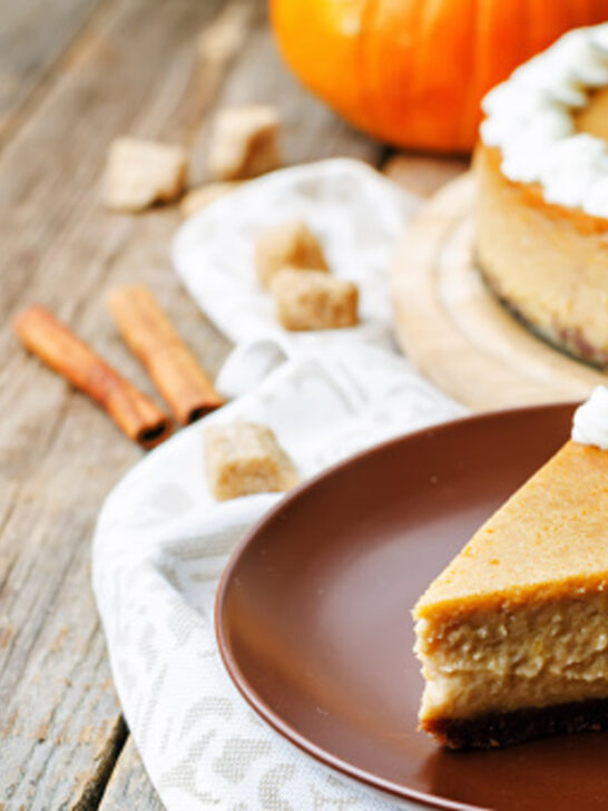 Slice of pumpkin cheesecake cut and served in a plate