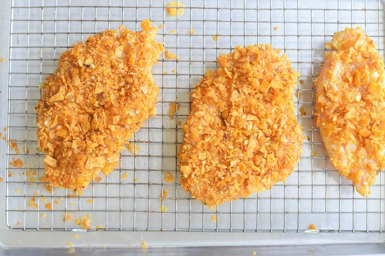 Breaded chicken placed on a rack