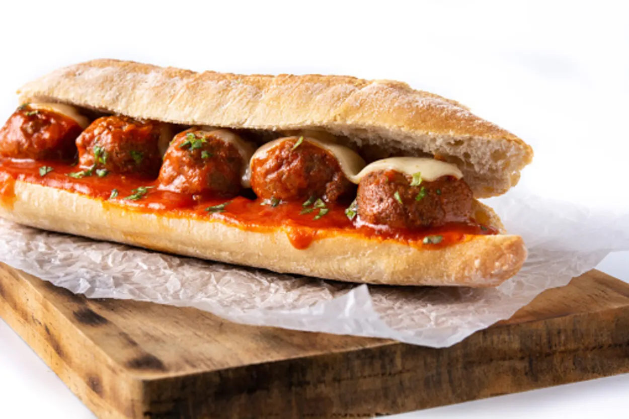 meatball sub placed on a wooden board