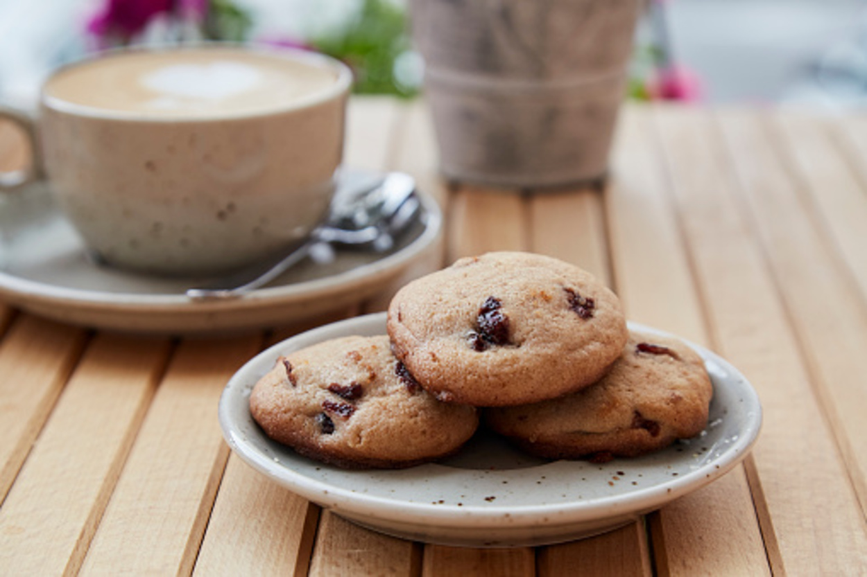 chocolate chip cookies served with coffee in an outdoor setting