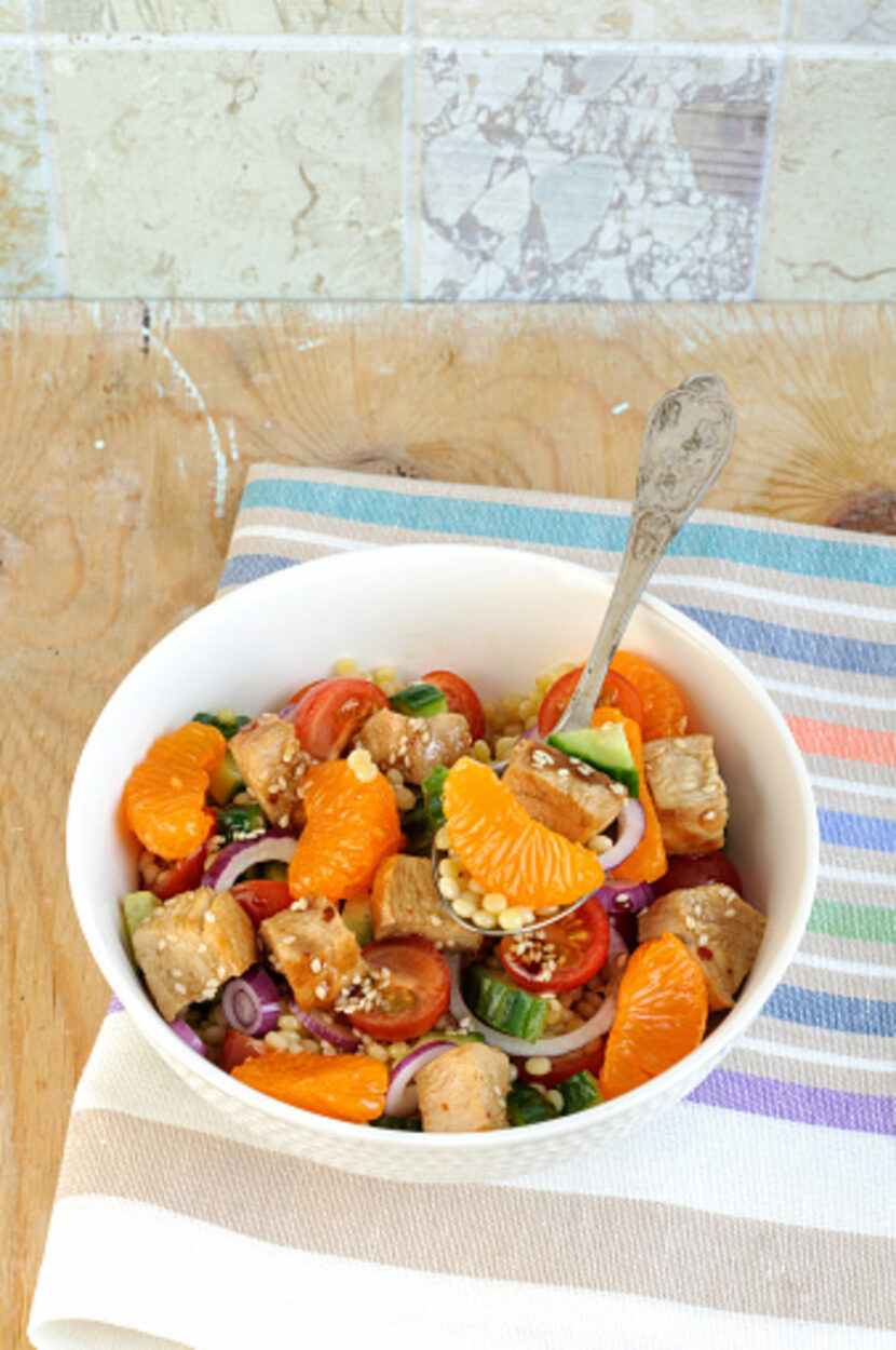 chicken salad bowl with oranges, onions, and tomatoes 