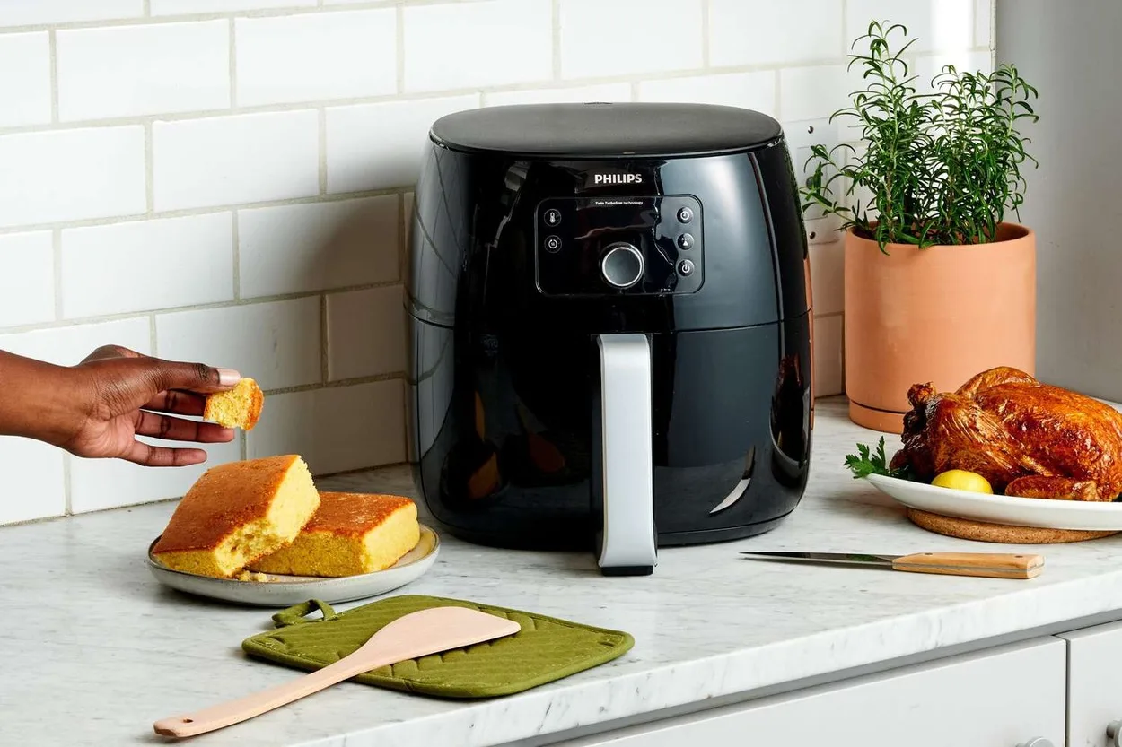 Air fryer with cooked food.