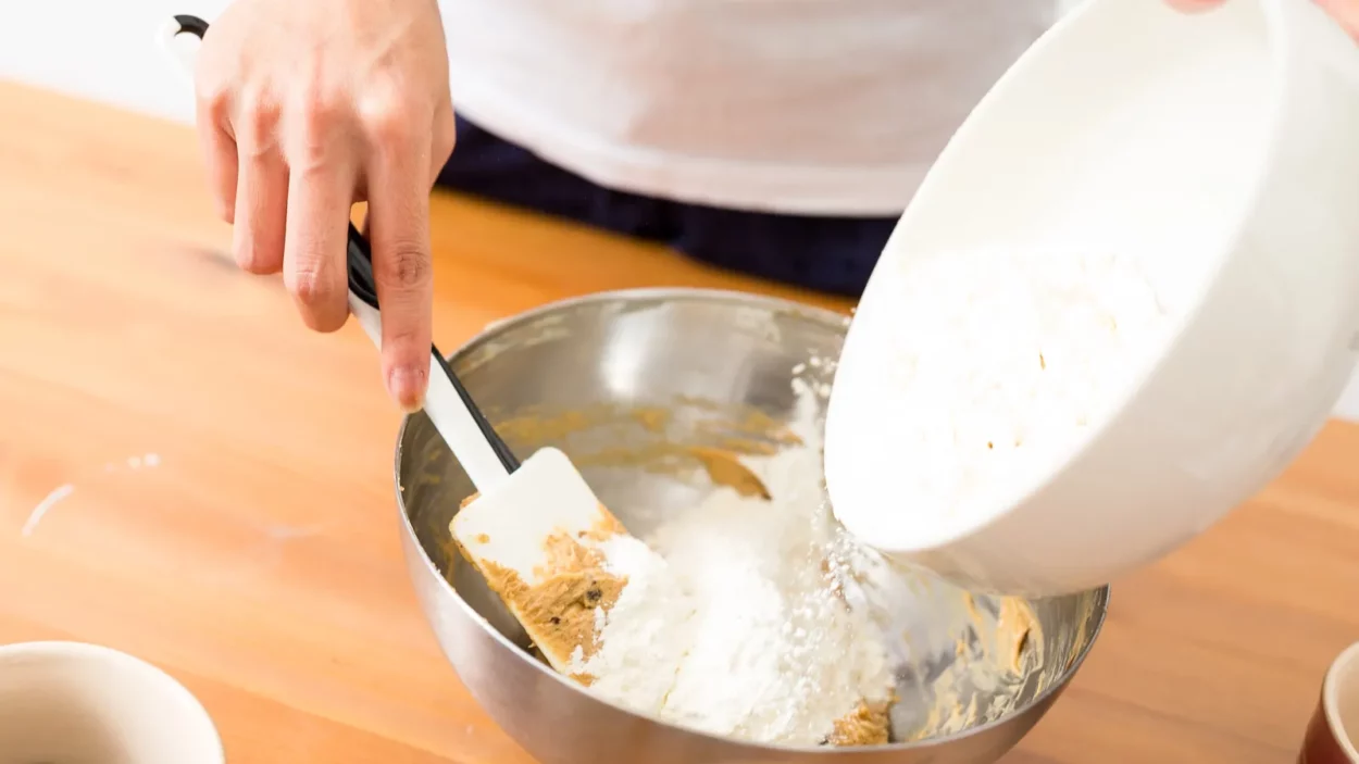 Adding flour inside batter.