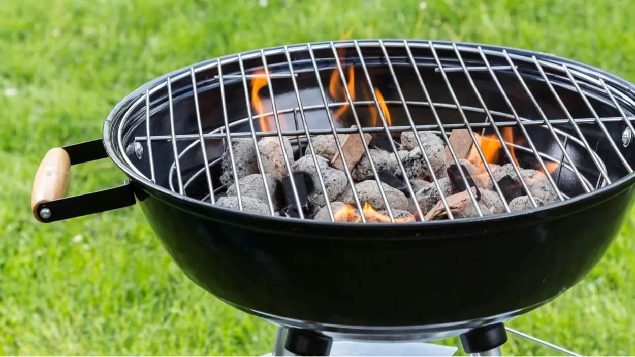 empty grill with fire on garden