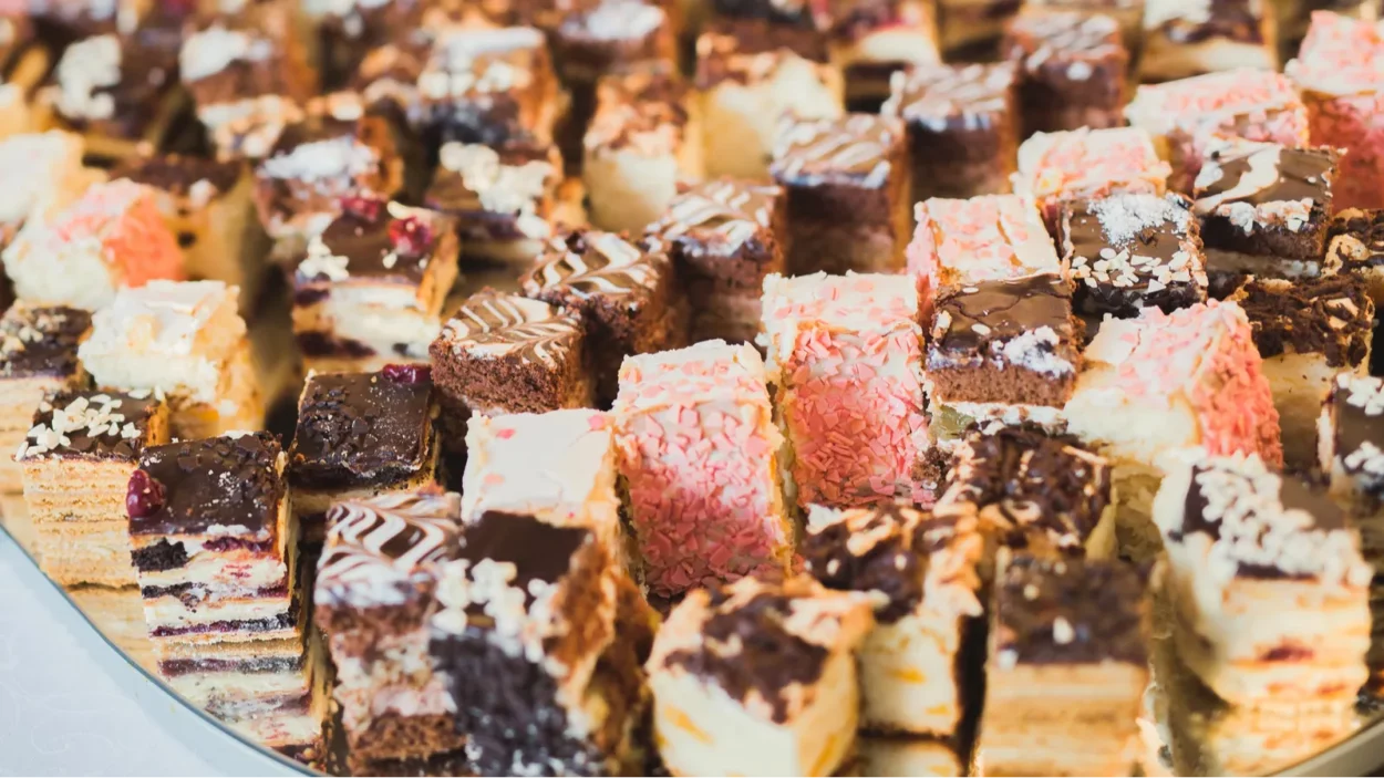 Delicious and tasty dessert table with cakes.