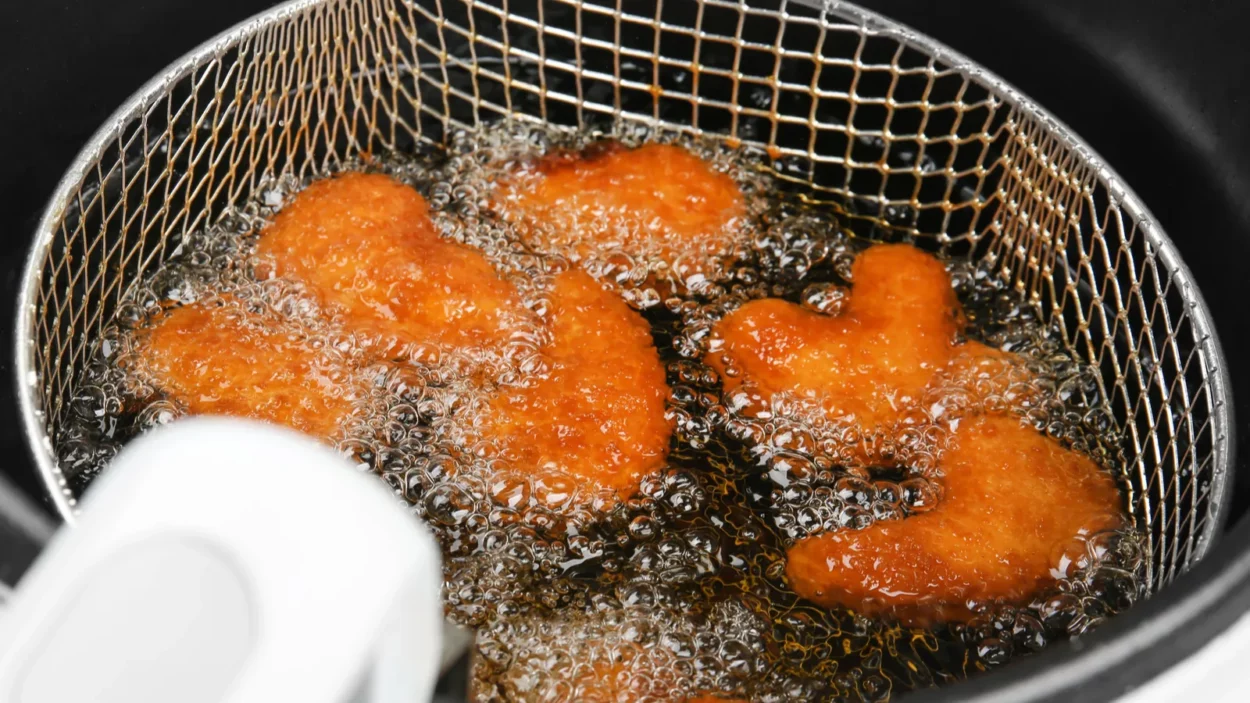 nuggets in deep fryer closeup