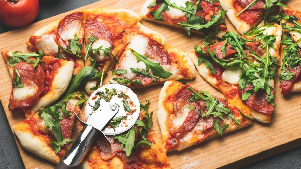 pizza or flatbread with arugula salami cheese