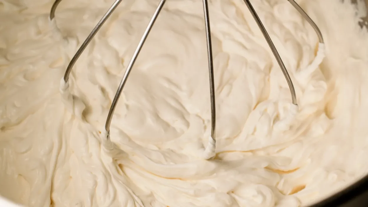 the cream whipping process is captured in motion showing the
