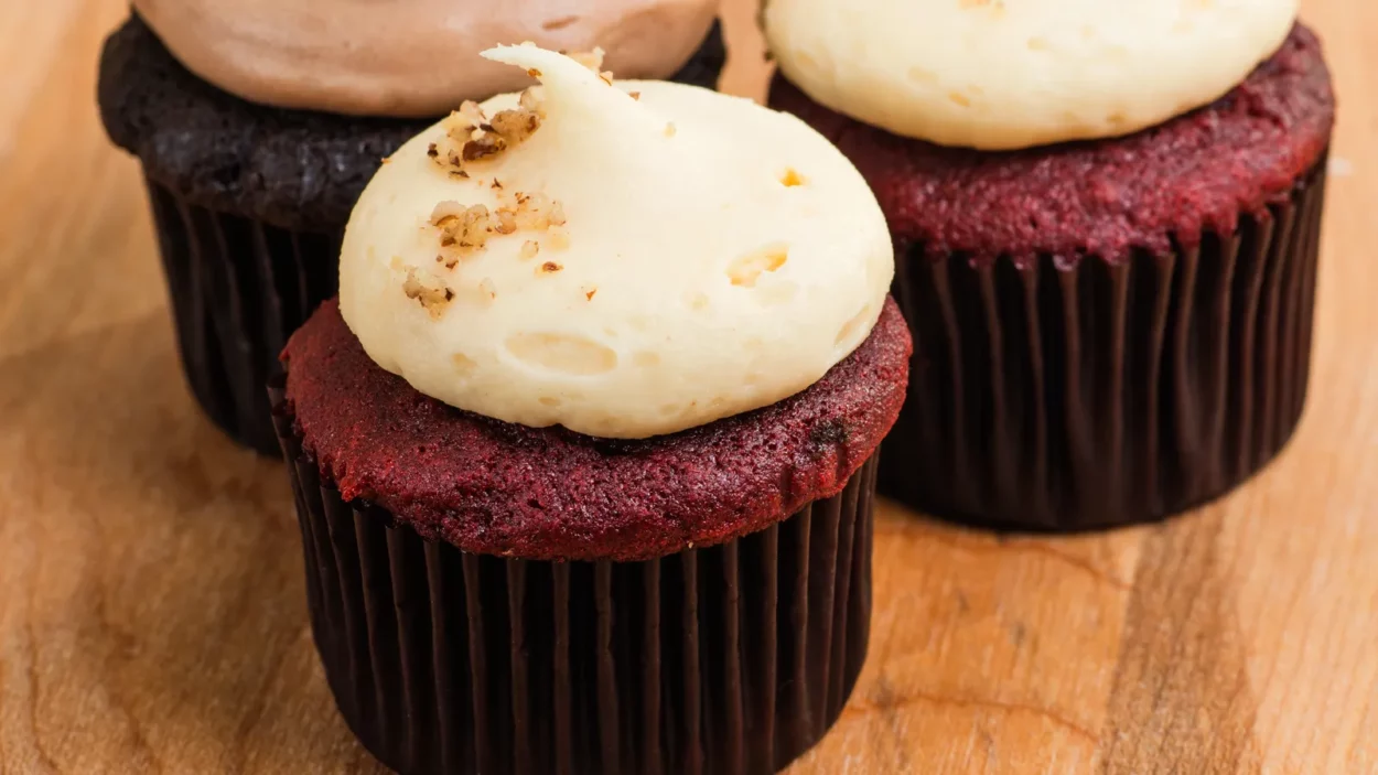 trio of chocolate and red velvet mini cupcakes with cream