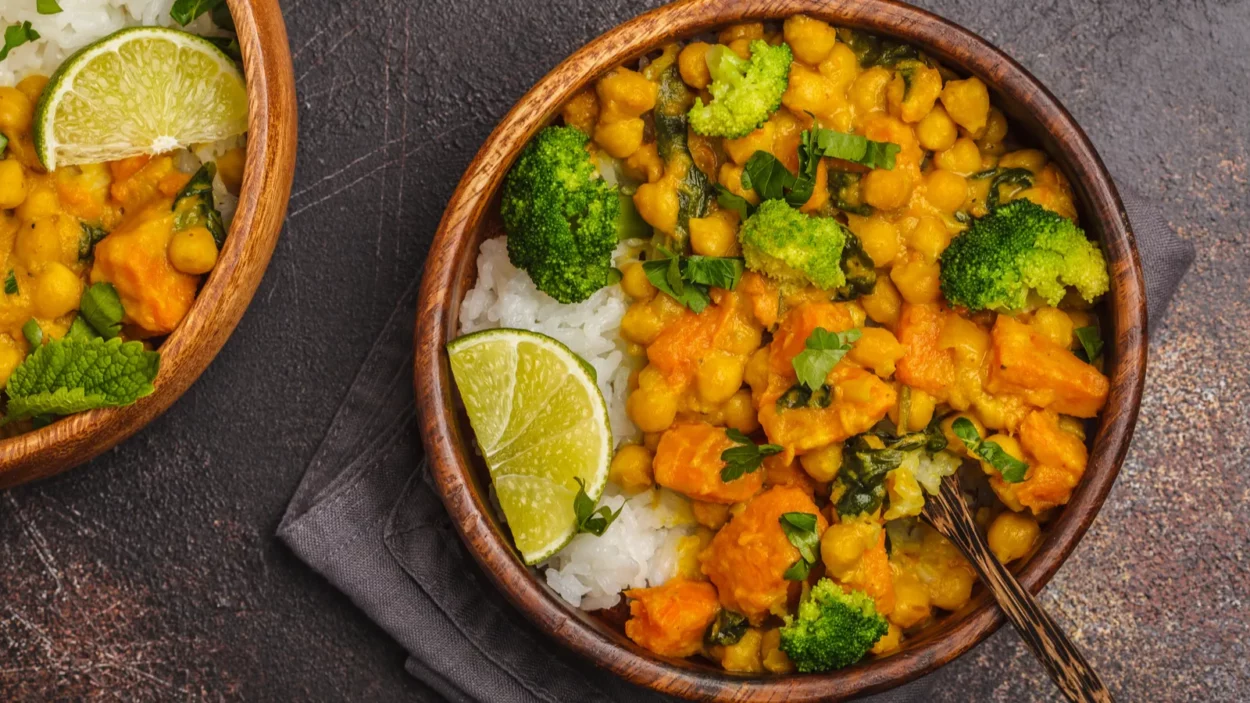 vegan sweet potato chickpea curry in wooden bowl on a