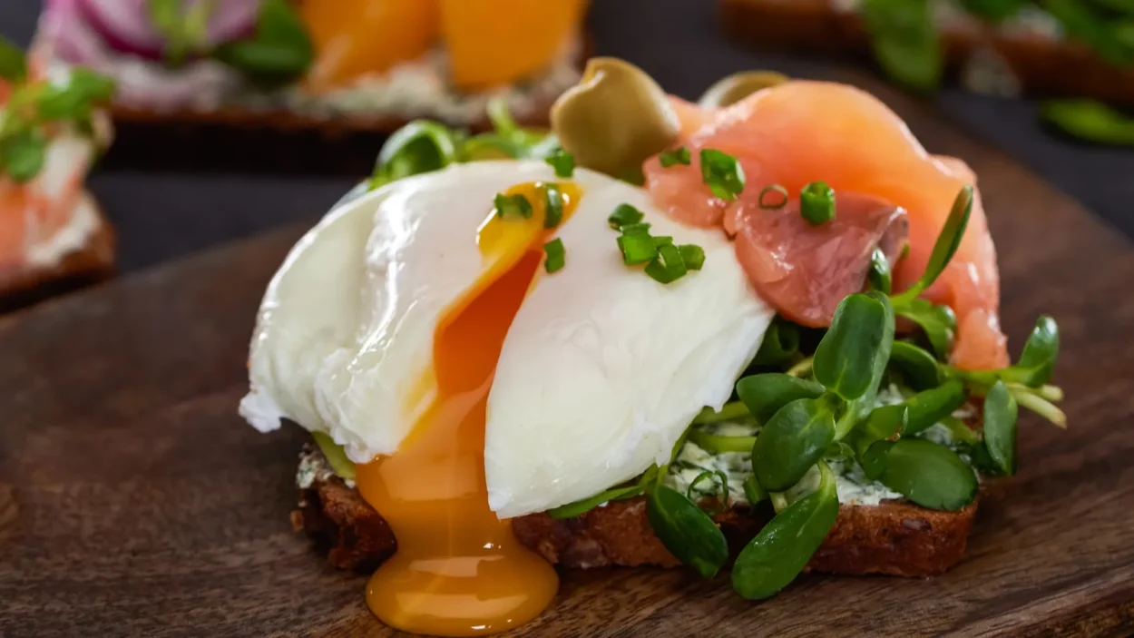 close up of danish smorrebrod sandwich with poached egg near