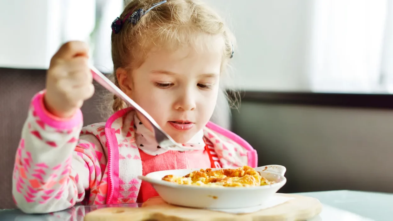 girl eating in restaurant