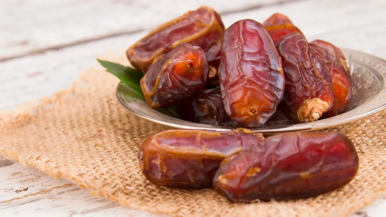 sweet dried dates served on wooden table
