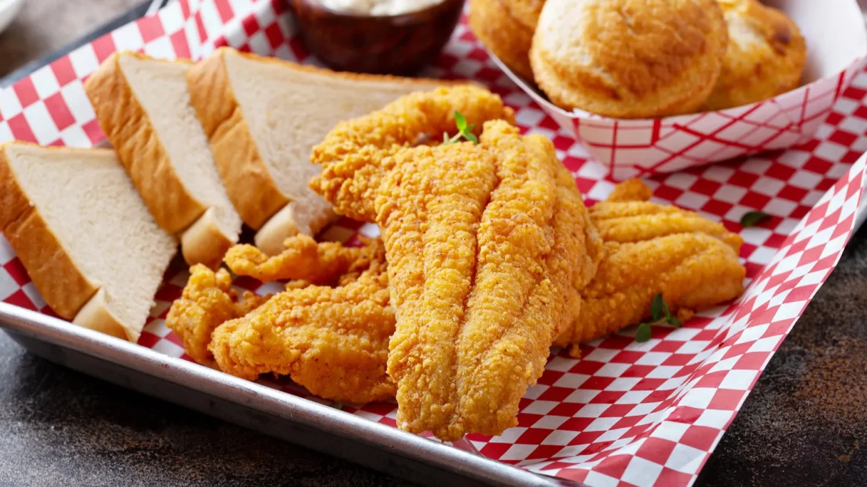 Fried catfish with cornbread dipped with buttermilk and seasoned with cornmeal, southern tradition.