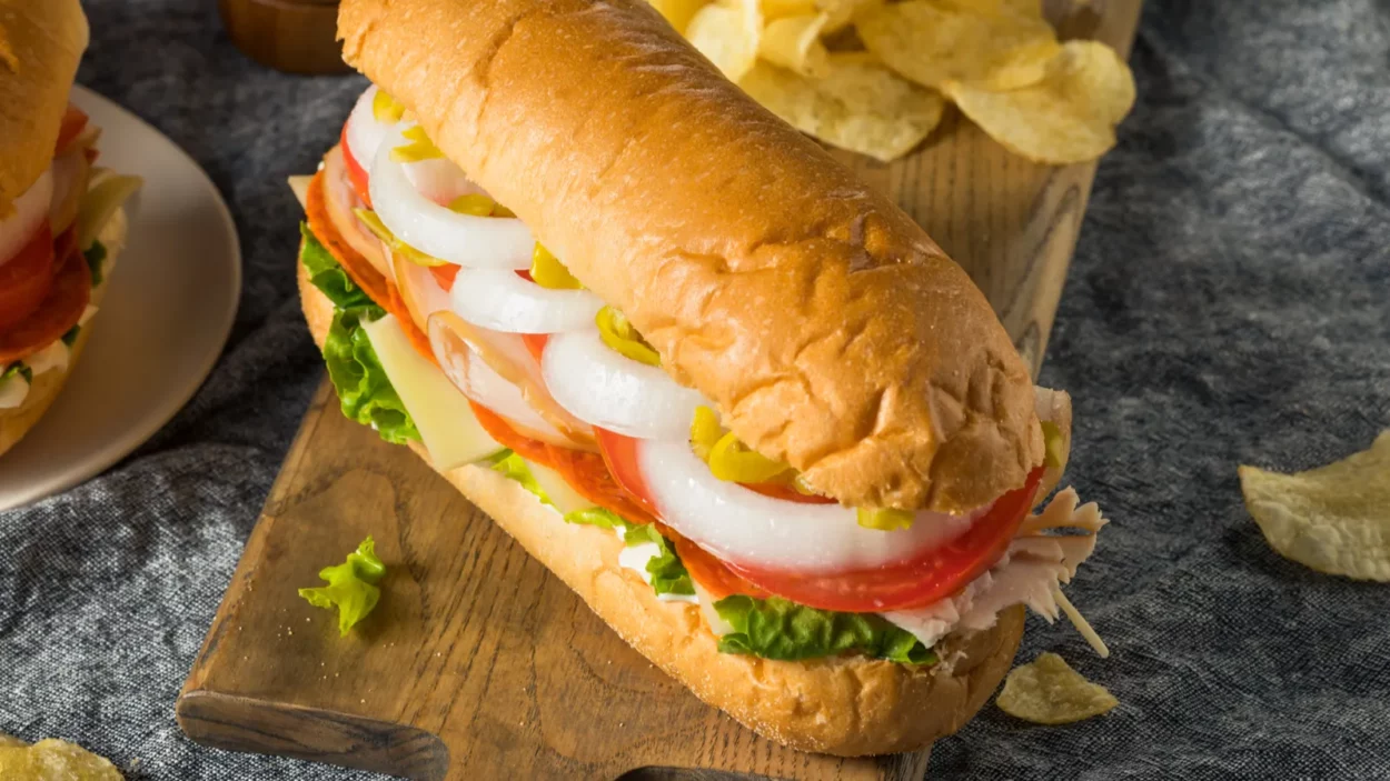 Homemade turkey sub sandwich with salami lettuce and tomato.