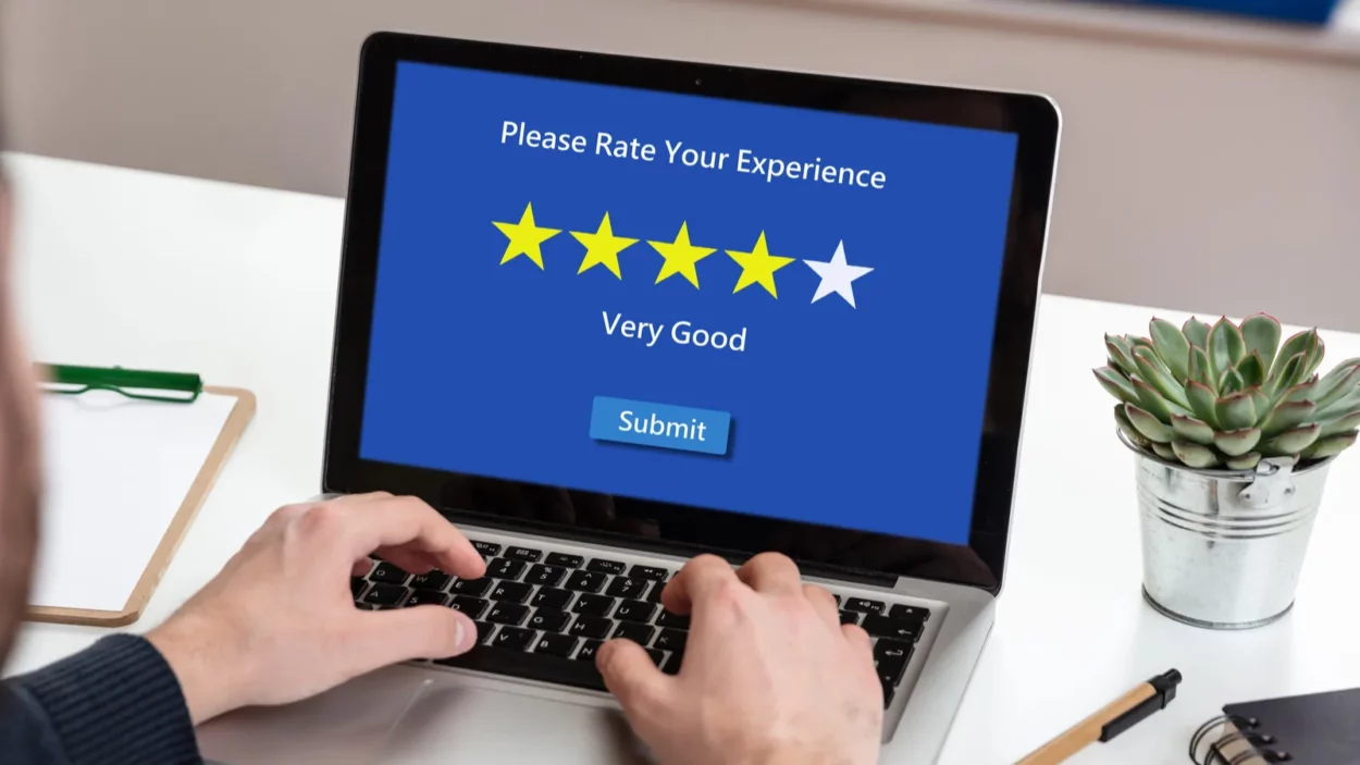 Very good rating review concept. Man working with a computer, 4 stars.