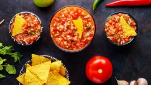 salsa sauce with ingredients for making homemade mexican salsa sauce